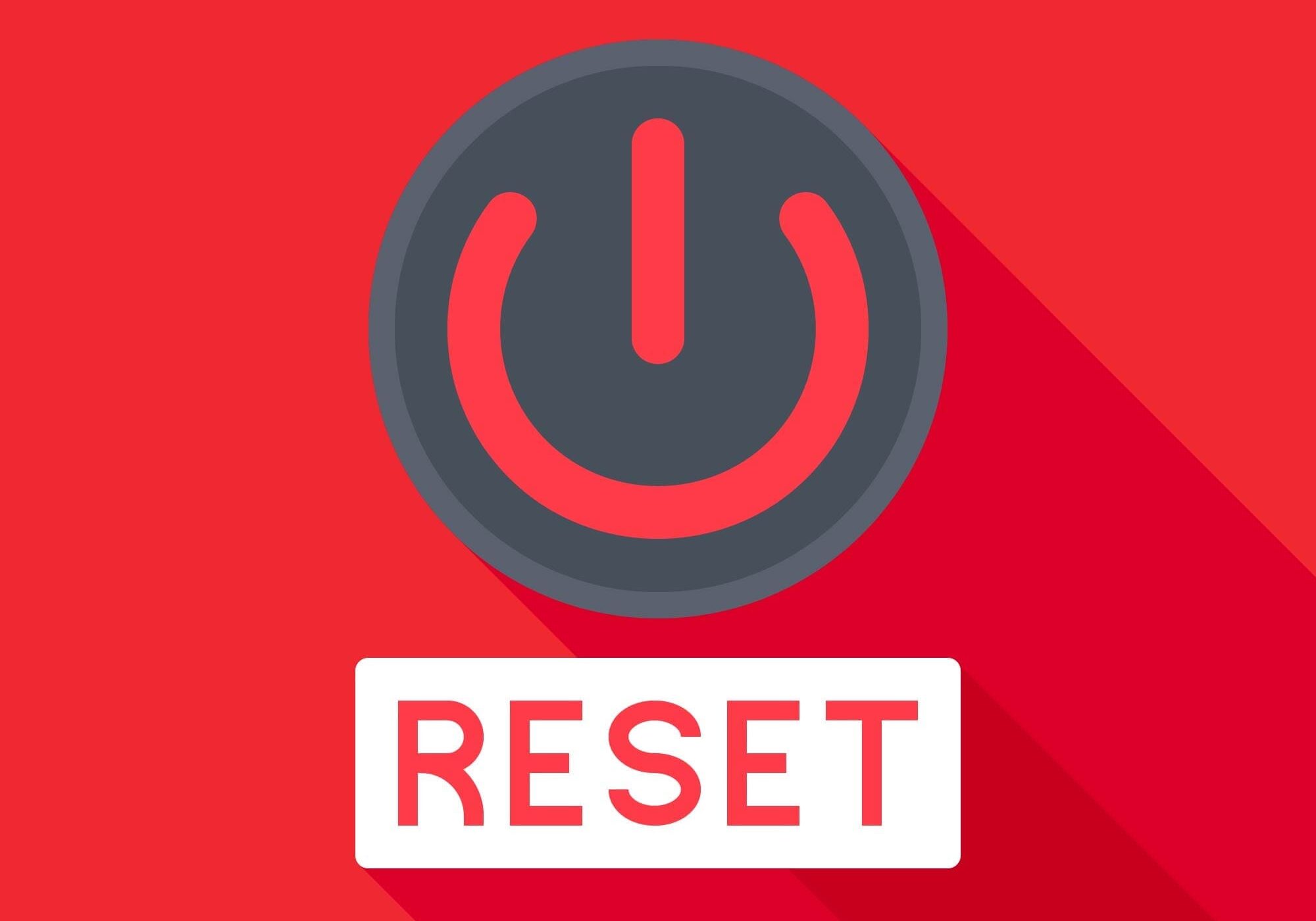 Power symbol above RESET label